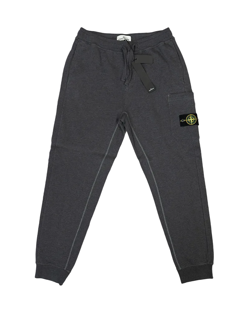 Dark gray jogger pants with a brand logo on a textured gray background